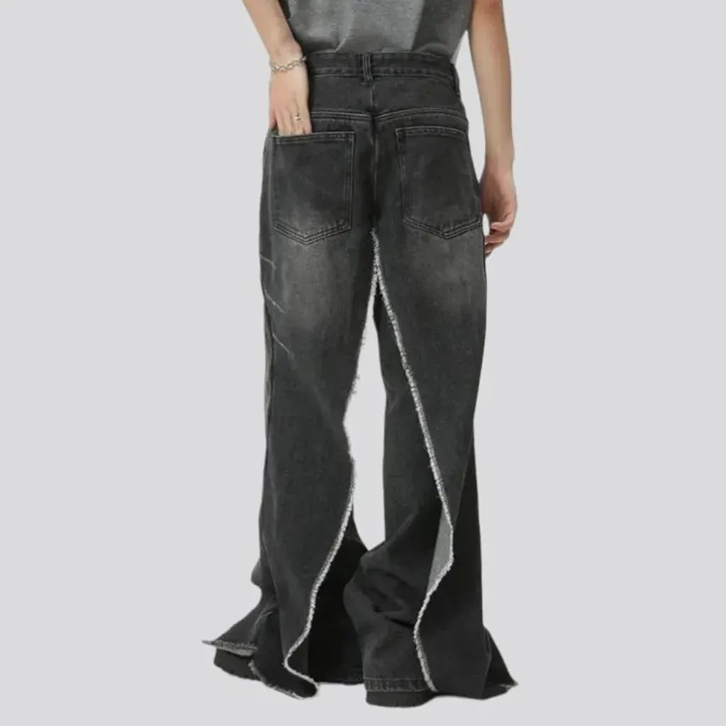 Distressed men's layered jeans