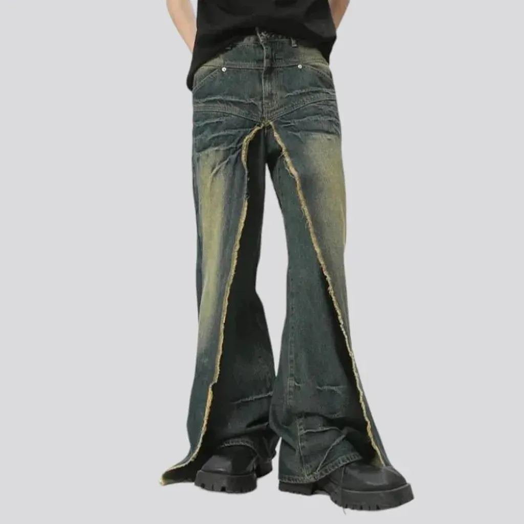 Distressed men's layered jeans