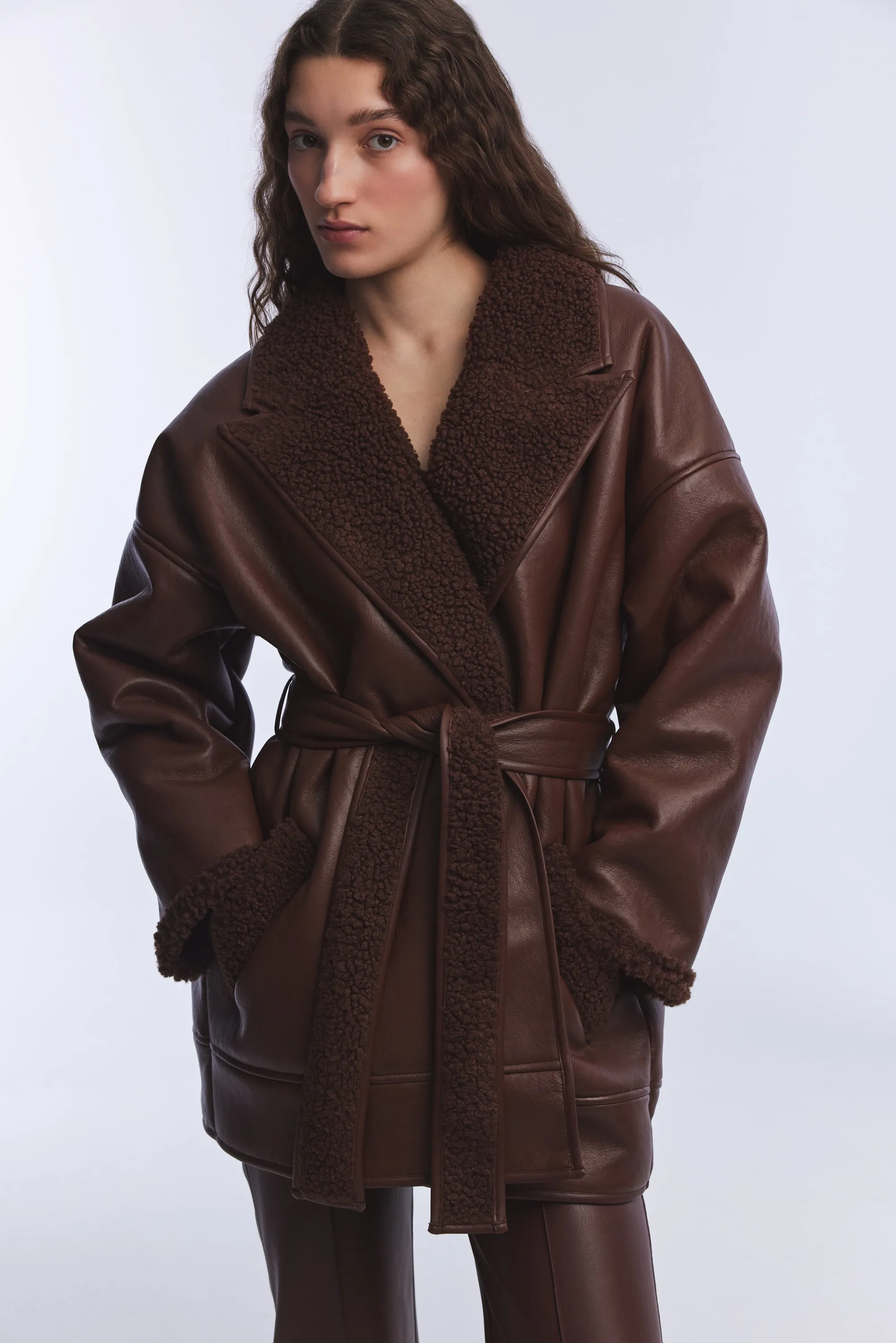 KHAKI VEGAN LEATHER TEDDY DETAILED COAT WITH TIE DETAIL