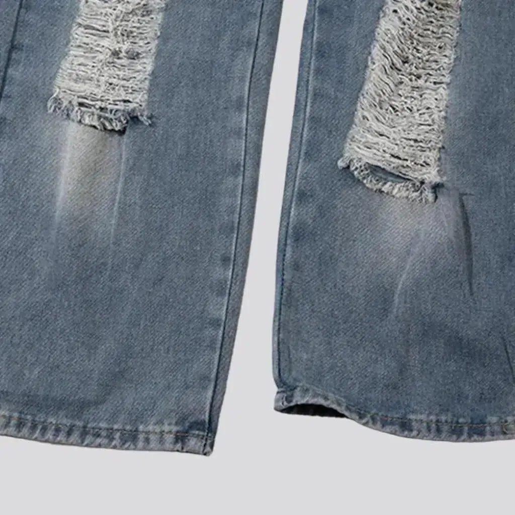 Medium-wash distressed jeans
 for men