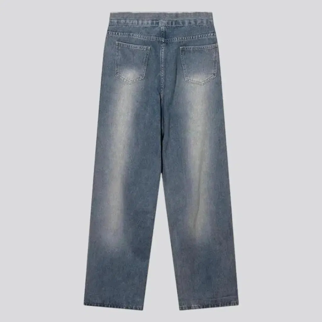 Medium-wash distressed jeans
 for men